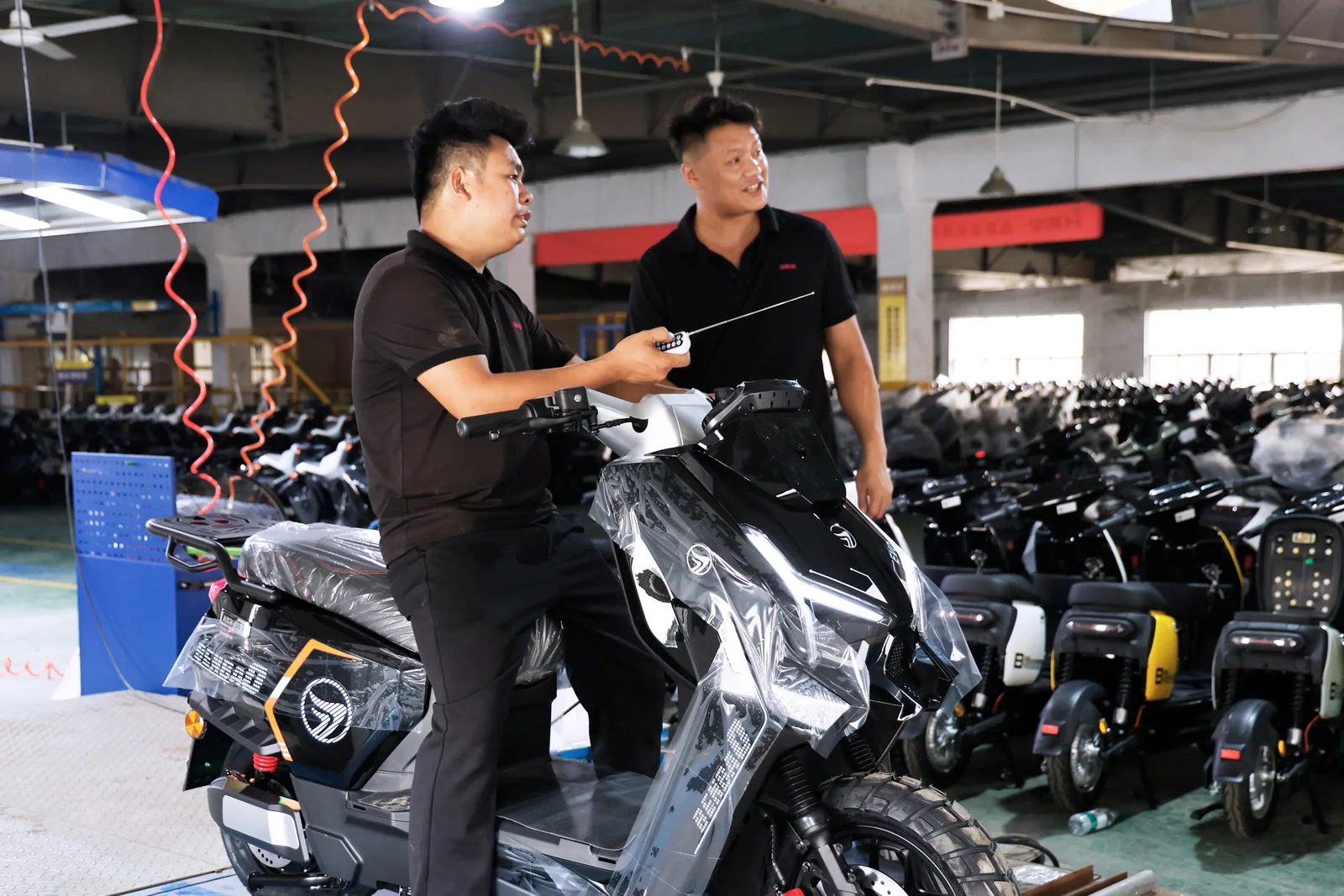 Staff reviewing a vehicle at the inspection area