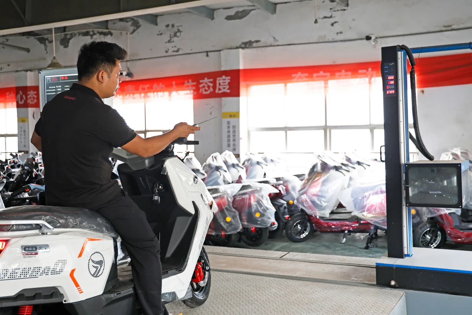 An operator at the vehicle inspection station