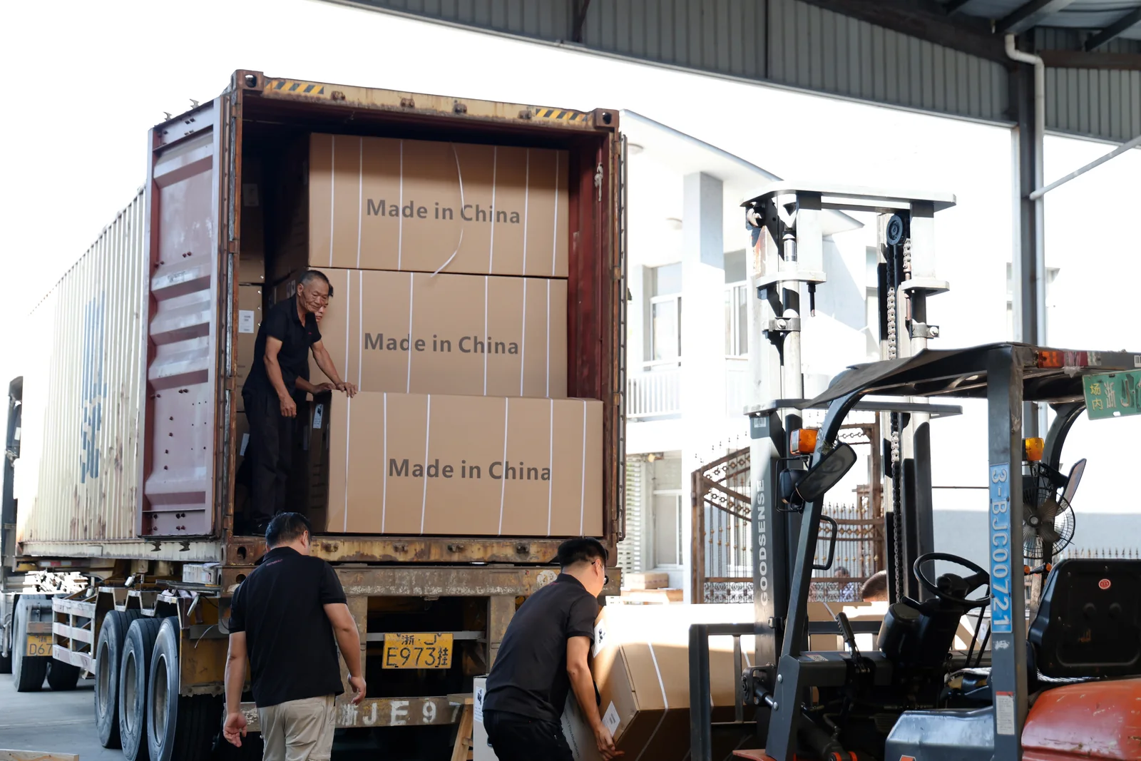 Packaged goods being loaded into a shipping container